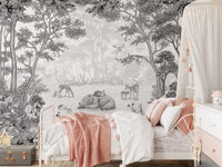 Woodland wildlife wall mural above a pink metal bed with a soft throw and a canopy GD12399