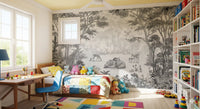 Woodland wildlife wall mural behind a wooden bed with a colourful patchwork blanket GD12399