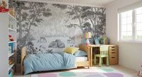 Woodland wildlife wall mural in a kids room with blue bedding and a green study chair GD12399