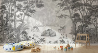 Enchanted woodland wildlife mural behind a wooden stool, patterned pouf and train toy GD12399
