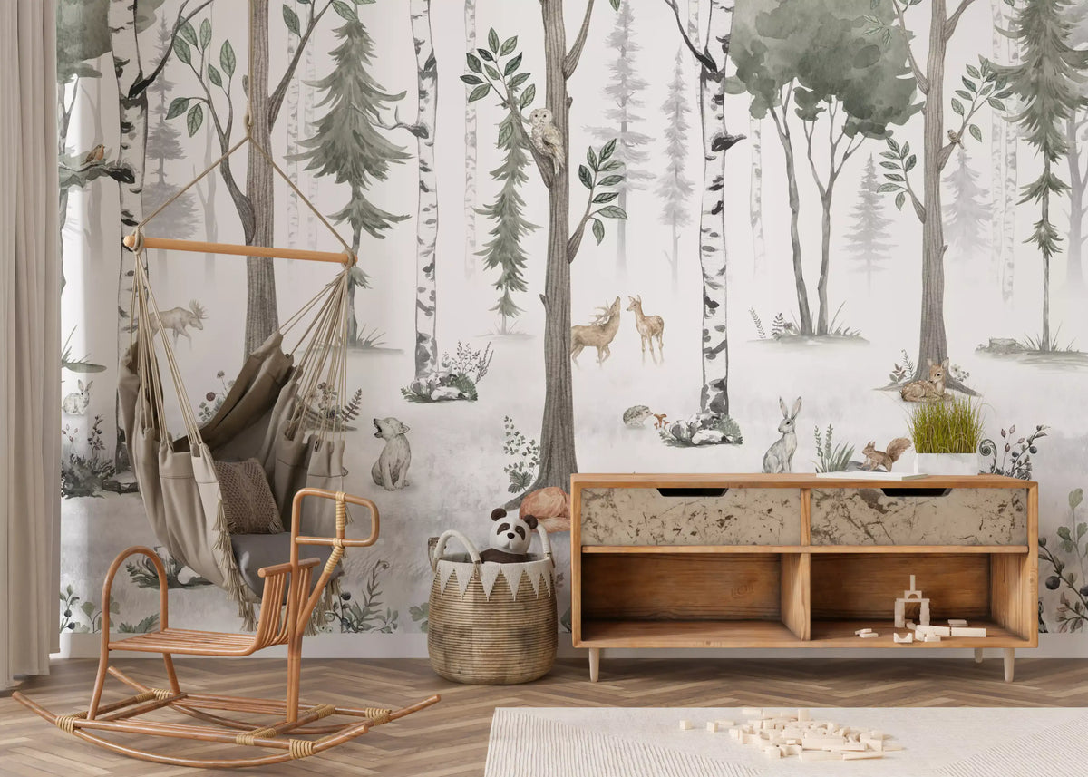 Misty woodland animal wall mural behind a rattan swing chair and a wooden sideboard GD12401