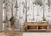 Misty woodland animal wall mural behind a rattan swing chair and a wooden sideboard GD12401