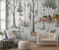 Green birch forest mural in a nursery with a white crib, grey armchair and floor lamp GD12401