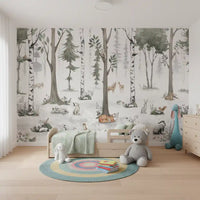 Misty woodland animal wall mural above a low bed with a mint throw and a plush bunny GD12401