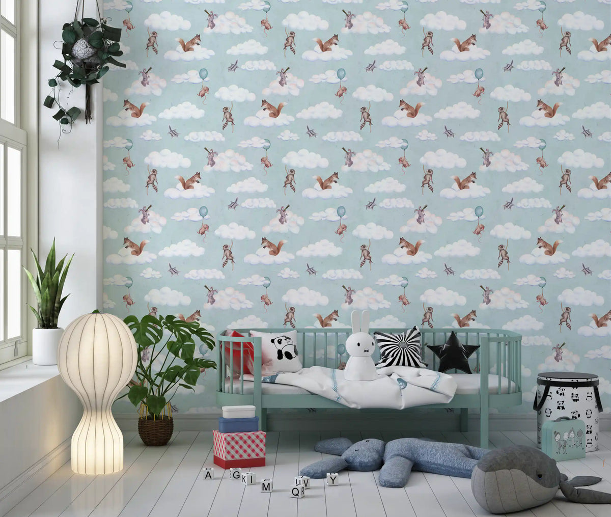 Floating forest friends wallpaper in a nursery with a mint crib and plush elephant GD12418