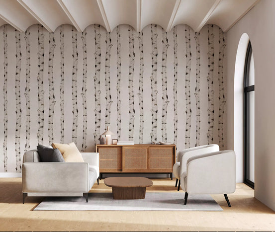 Rustic birch forest wallpaper in a living room with cream armchairs and rattan sideboard GD12422