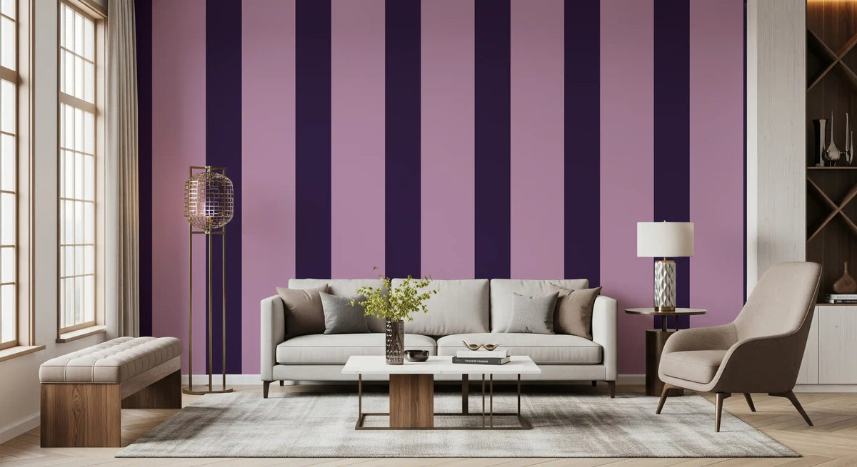 Deep plum and lilac striped wallpaper behind a beige sofa and brown accent chair GD12446