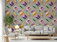 Royal gemstones pink pastel wallpaper behind a grey sofa and armchair with a tall plant GD12449