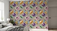 Gemstone mosaic wallpaper behind a grey bed dressed with a soft throw GD12449