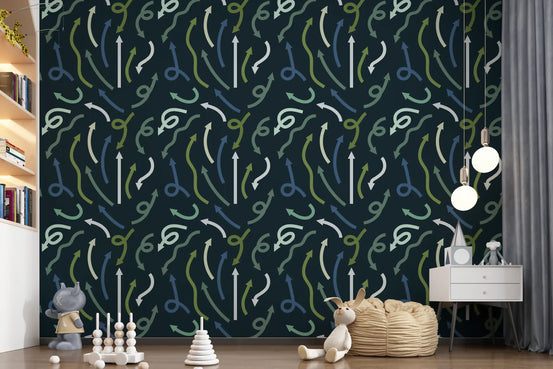 Directional arrows wallpaper in a nursery with wooden stacking toys and open shelving GD12450