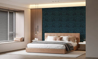 Navy leaf wallpaper in a bedroom with a tan upholstered bed and window blinds GD12456