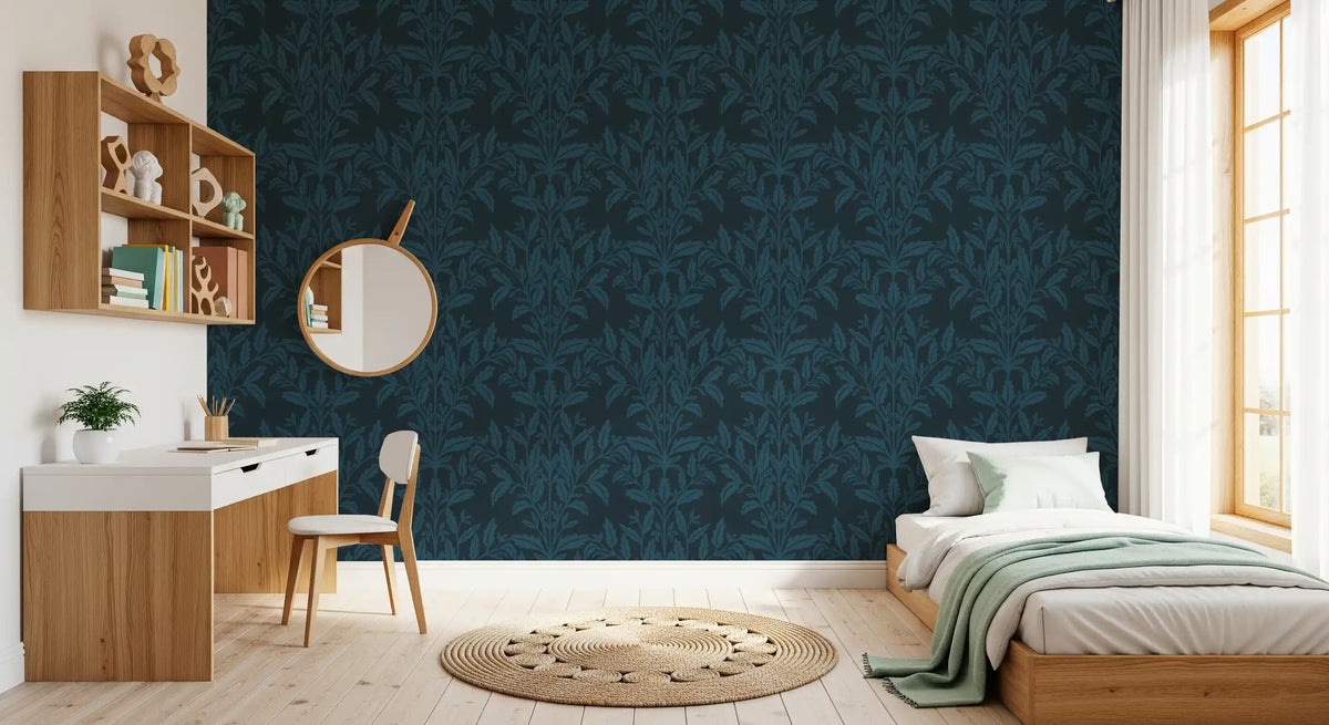Navy leaf wallpaper in a study nook with white desk, round mirror and single bed GD12456
