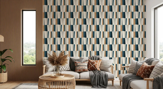 Abstract geometric vertical panel wallpaper behind a grey sofa with pampas grass and rattan table GD12462
