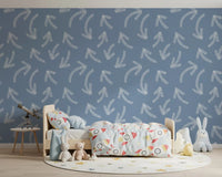 Muted blue scribble arrows wallpaper in a toddler room with teddy bears and star rug GD12470