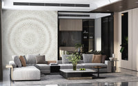 Minimalist dot ripple mural in a living room with grey sectional and dark kitchen GD12474