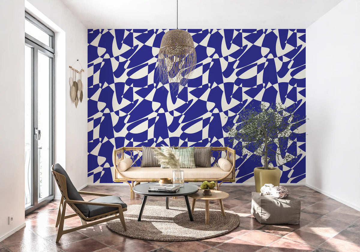 Abstract blue geometric wallpaper in a room with a black chair and terracotta tile floor GD12480