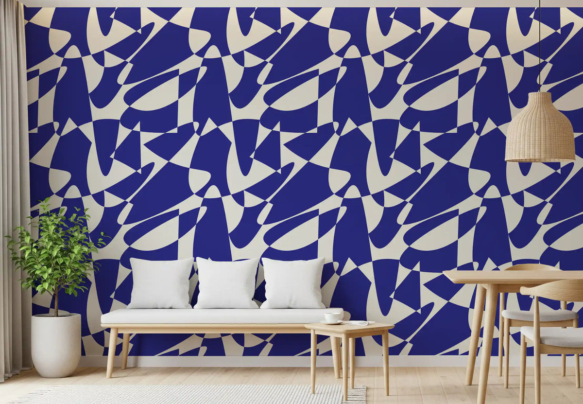 Cobalt geometric shapes wallpaper above a white cushioned bench with a potted plant GD12480