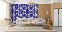 Abstract cobalt geometric wallpaper in a living room with beige sofa and wooden rocking chair GD12480