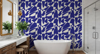 Cobalt blue geometric wallpaper in a bathroom with a freestanding tub and marble vanity GD12480