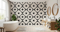 Monochrome star grid wallpaper in a bathroom with a freestanding tub and round mirrors GD12482
