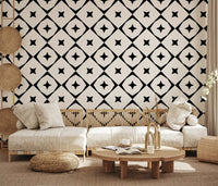 Geometric star grid wallpaper behind a cream sofa and low wooden table GD12482
