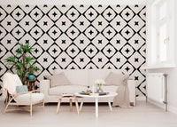 Geometric star grid wallpaper in a scandi living room with a beige sofa and round tables GD12482