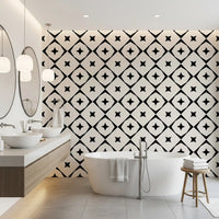 Black and white geometric wallpaper in a bathroom with a freestanding tub and wood vanity GD12482