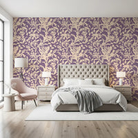 Botanical silhouette wallpaper behind a tufted bed with a pink accent chair GD12484