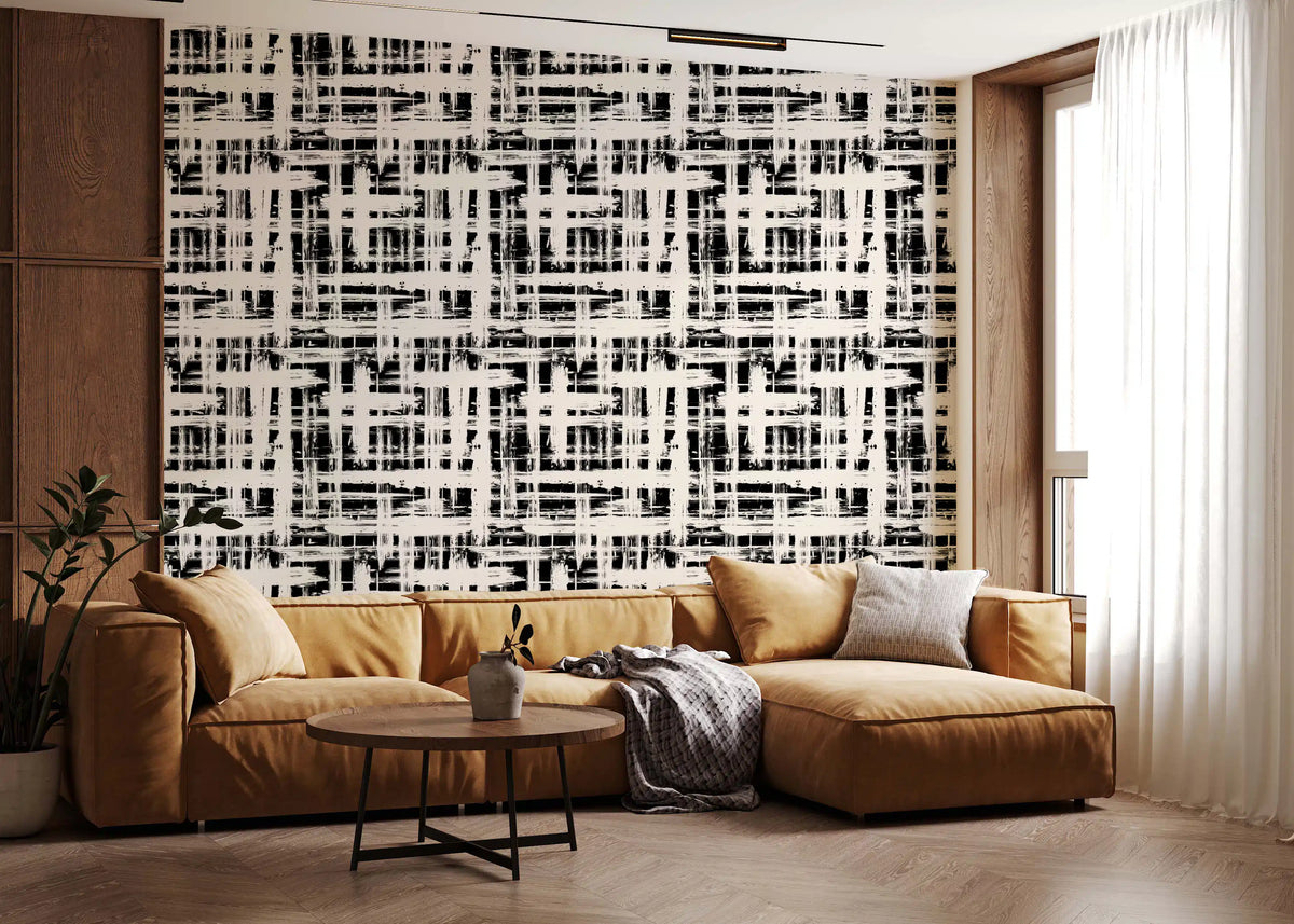 Monochrome crosshatch texture wallpaper behind a tan leather sectional GD12489