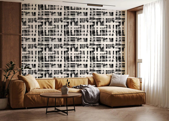 Monochrome crosshatch texture wallpaper behind a tan leather sectional GD12489