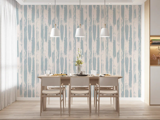 Blue brushstroke stripes wallpaper in a dining room with a grey table and pendant lights GD12491