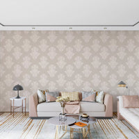 Cream damask scroll wallpaper in a living room with a blush sofa and patterned rug GD12492