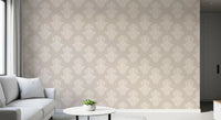 White sofa and small round table in a corner styled with creamy damask wallpaper GD12492