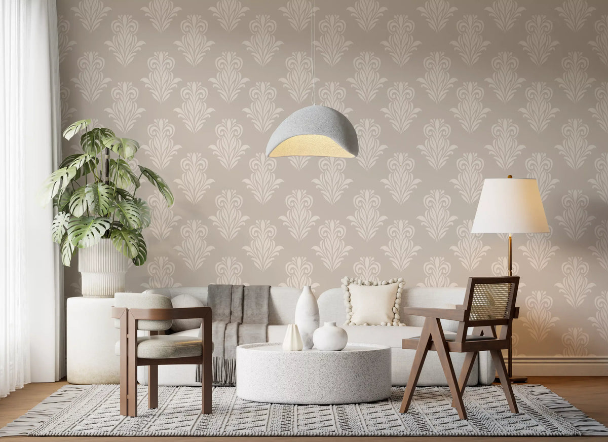 Beige sofa and wooden chairs by a monstera on cream damask scroll wallpaper GD12492