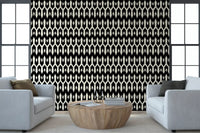 Two pale blue armchairs and a wood table on abstract interlocking diamond wallpaper GD12494
