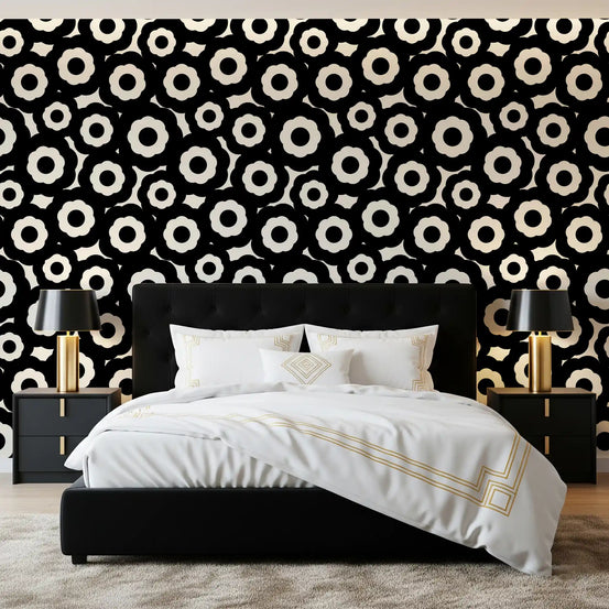 Modernist flower wallpaper in a bedroom with a black bed frame and gold lamps GD12495