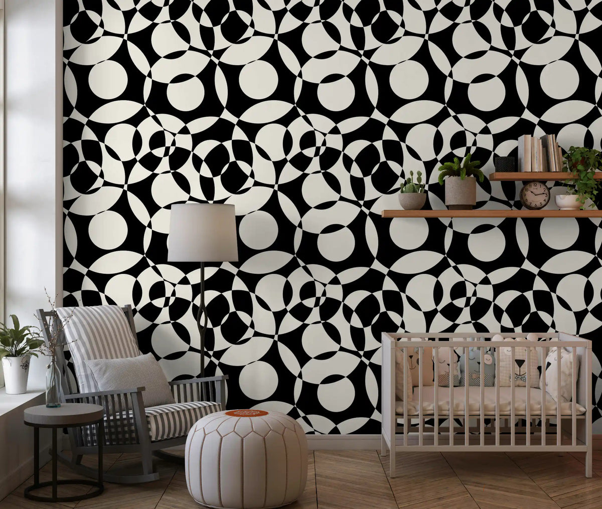 Interlocking monochrome circles wallpaper in a nursery with a white crib GD12497