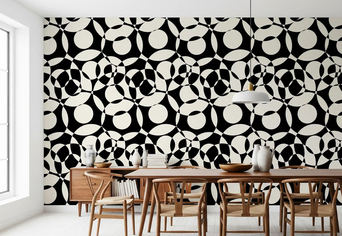 Geometric circles wallpaper behind a wood dining table with wishbone chairs GD12497