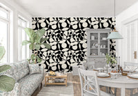 Monochrome circles wallpaper in a dining space with white cabinet and floral couch GD12497