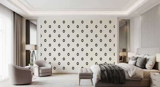 Black and white diamond wallpaper in a bedroom with a grey bed and armchair GD12502
