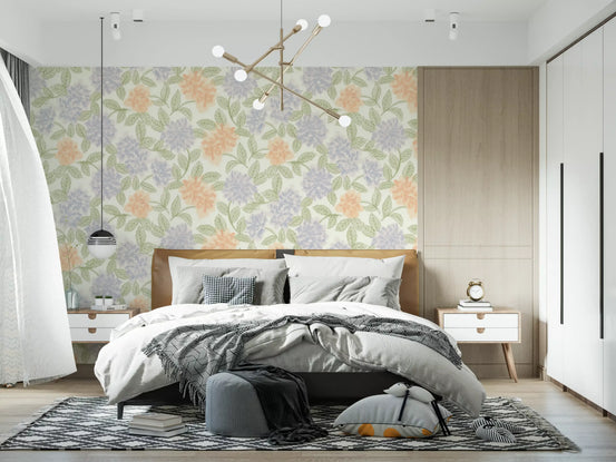 Blush and periwinkle garden sketch wallpaper behind a grey bed with soft bedding GD12640