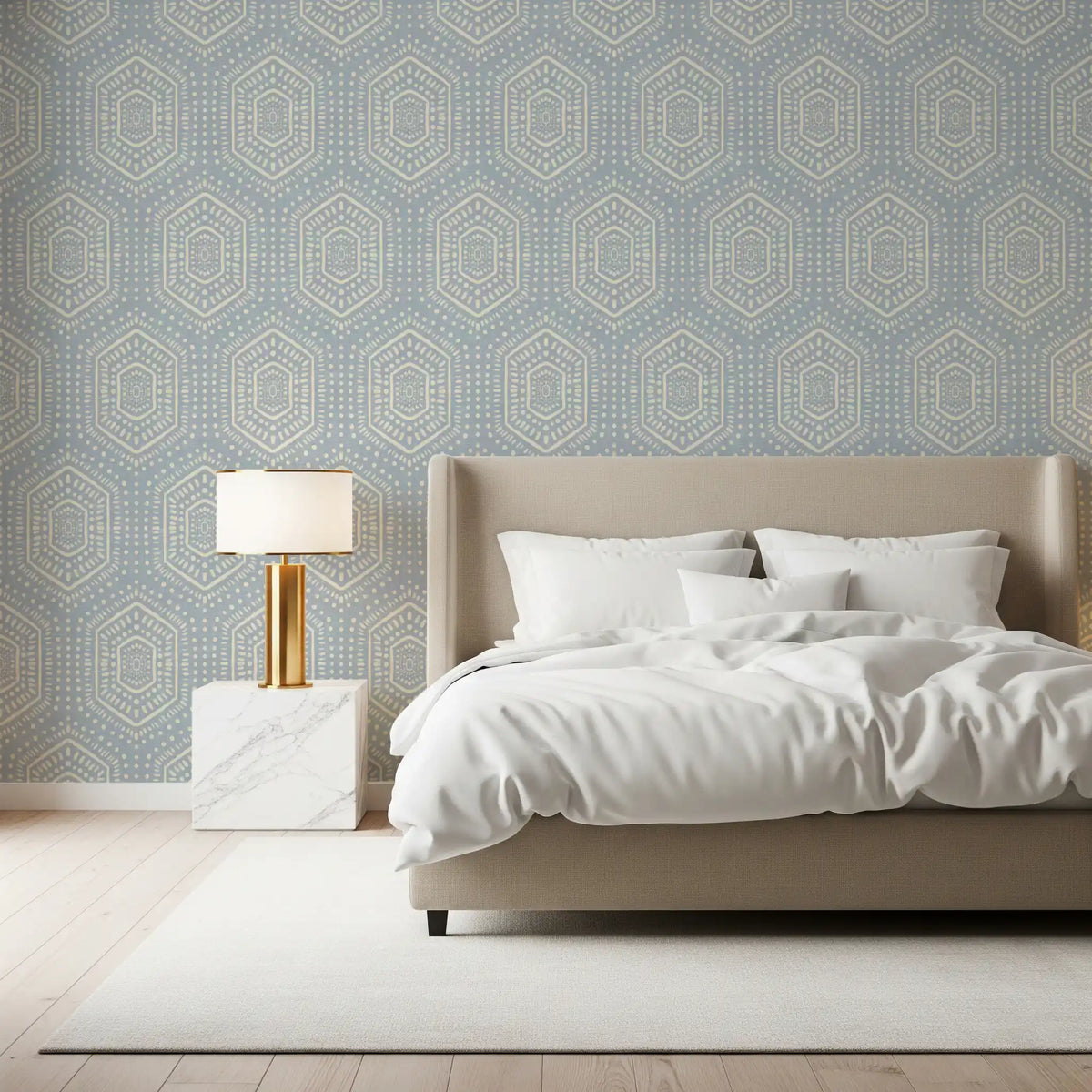 French blue boho hexagon mudcloth wallpaper behind an upholstered bed with white bedding GD12653