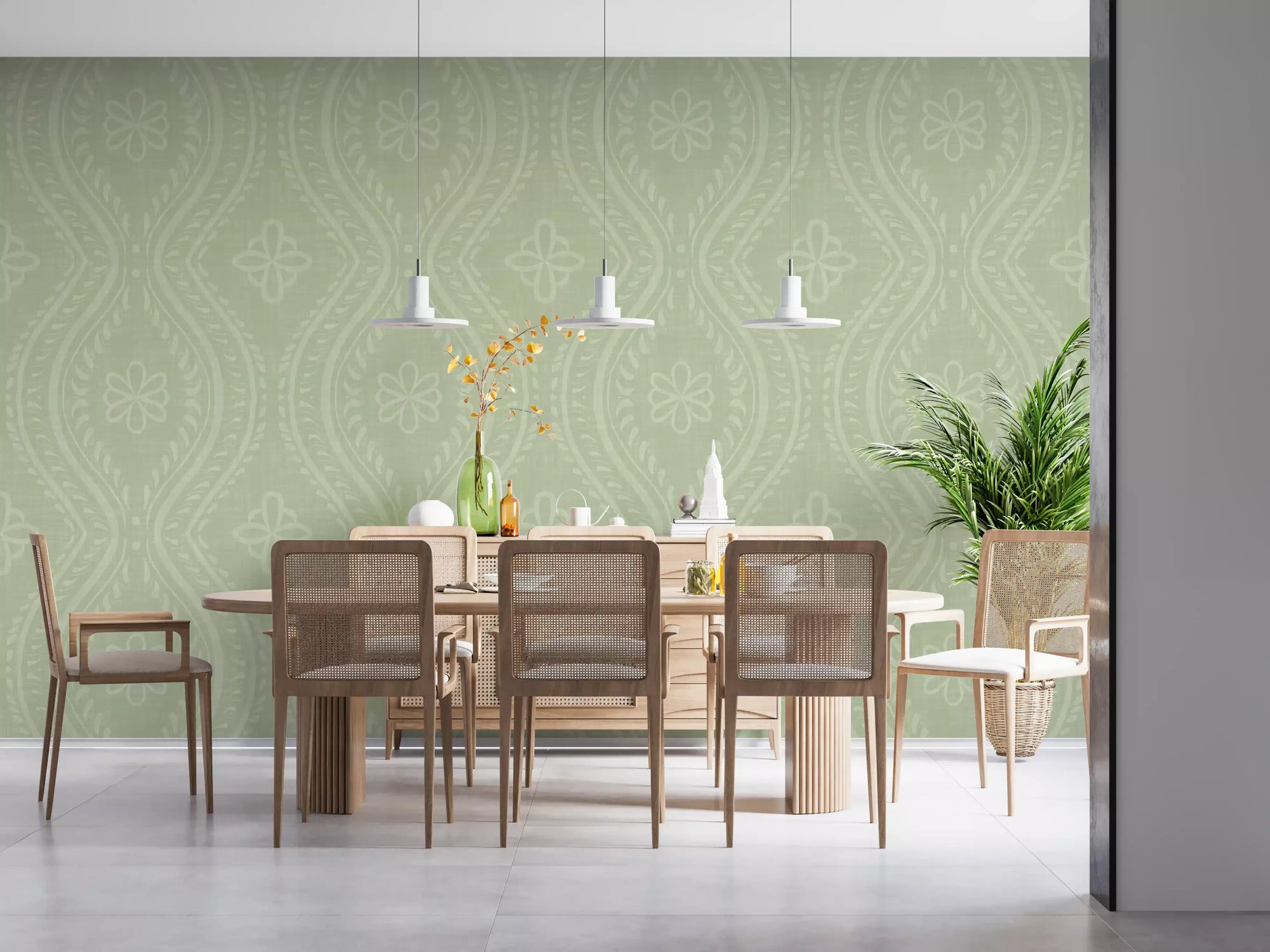 Sage green damask wallpaper in a dining room with a wood table and cane chairs GD12658