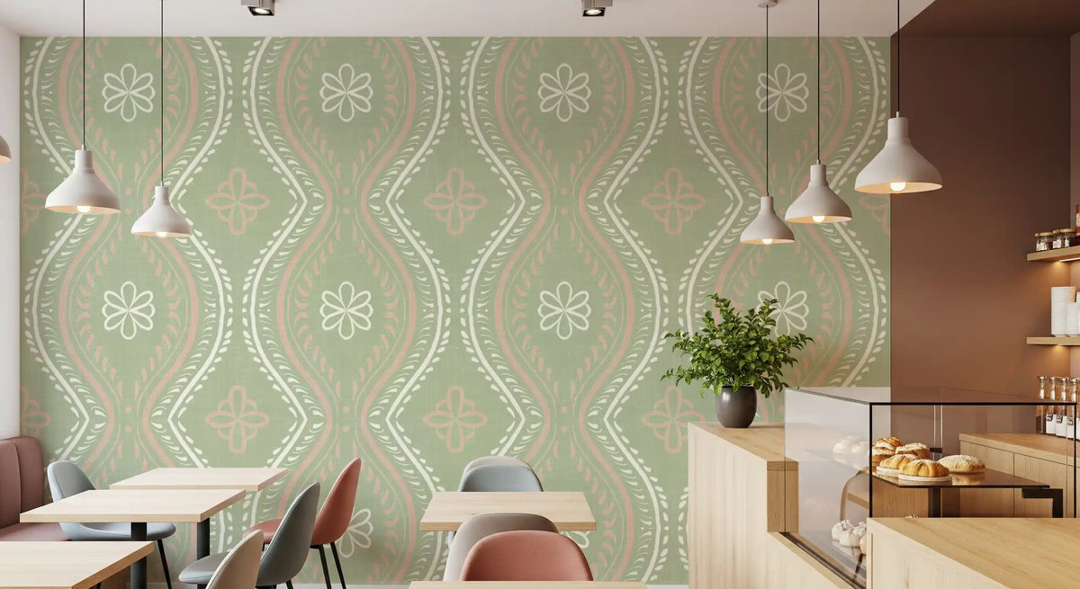 Sage green damask wallpaper in a dining area with pendant lights and a kitchen beyond GD12664
