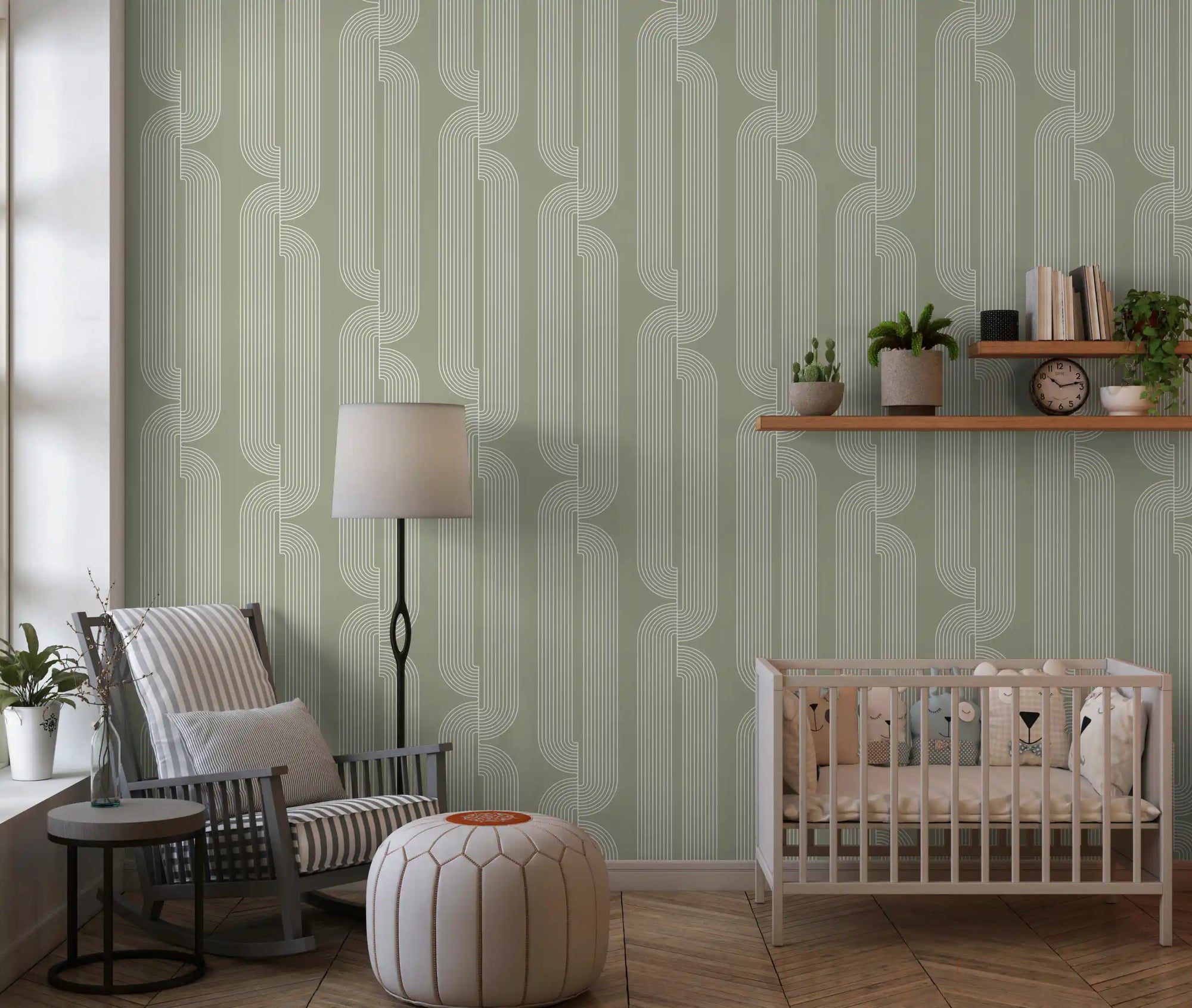 Sage green linear wallpaper in a nursery with a grey armchair and white crib GD12699