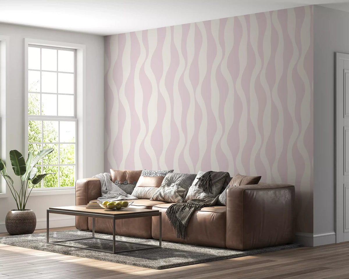 Minimalist soft pink flow wallpaper behind a brown leather sofa in a bright living room GD12708