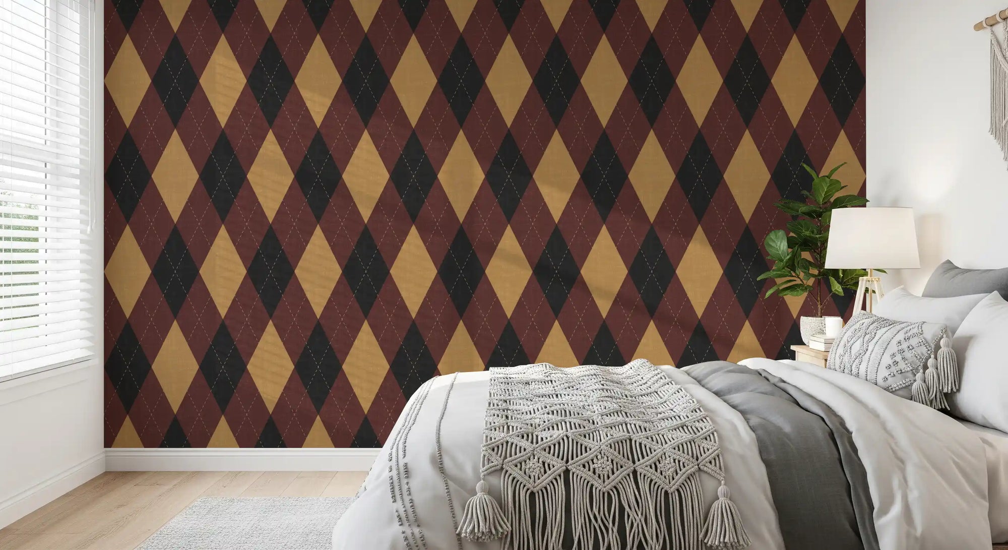 Argyle harlequin diamond wallpaper behind a white bed with a knit throw GD12726