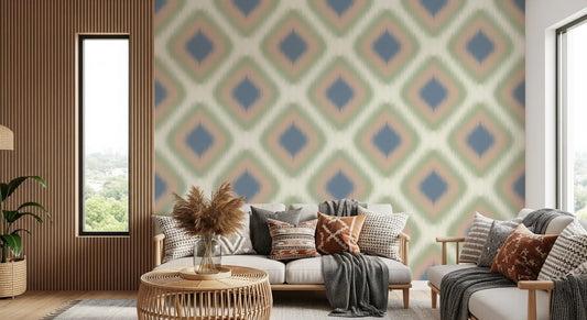 Denim blue and blush ikat wallpaper behind a sofa with boho pillows and pampas grass GD12756