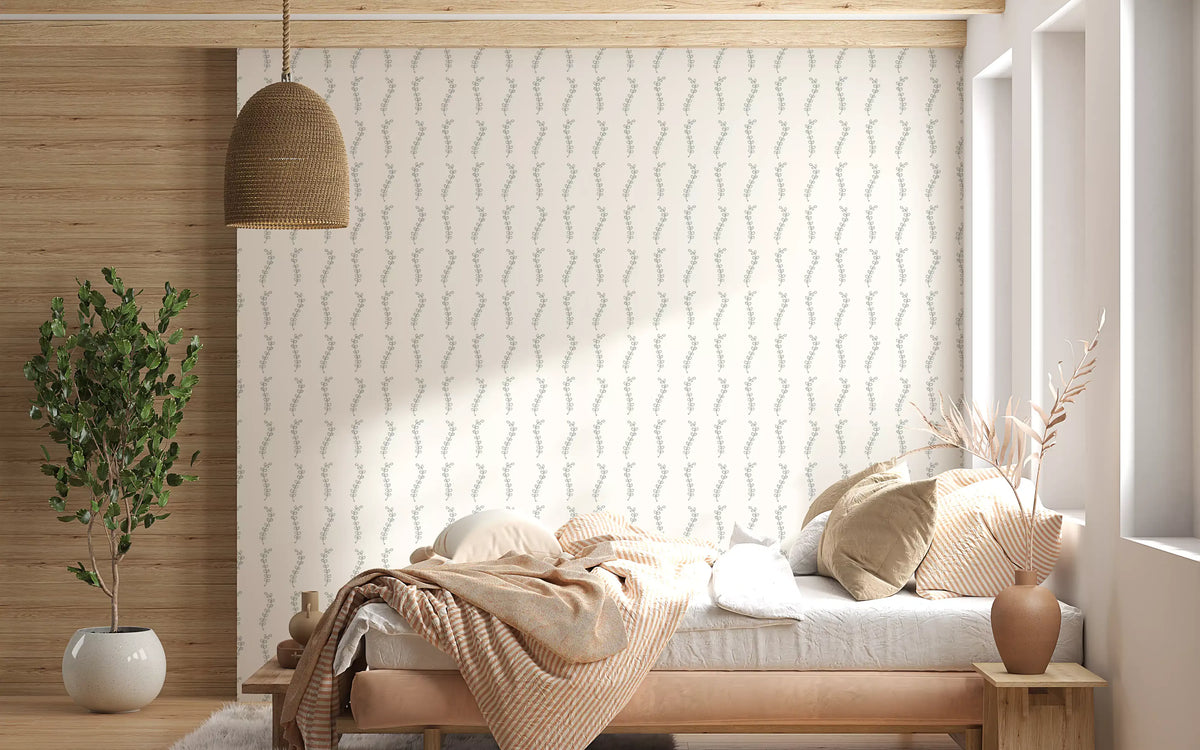 Minimalist sage leaf sprigs wallpaper in a bedroom with wooden bed and beige throw GD12769
