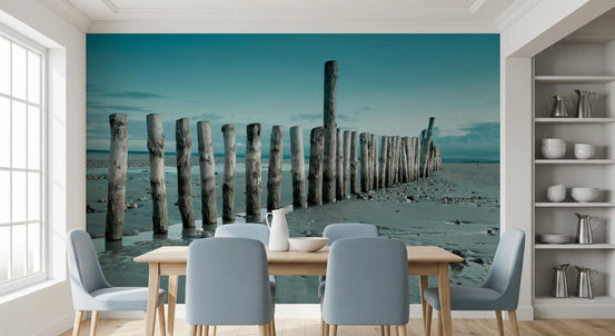 Minimalist Maritime Beach Scenery wall mural behind a wood table and blue chairs GD12814